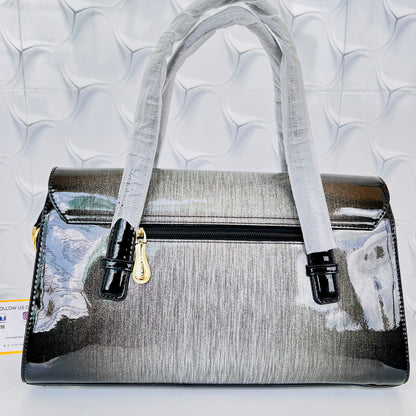 Designer shining leather handbag with stonework