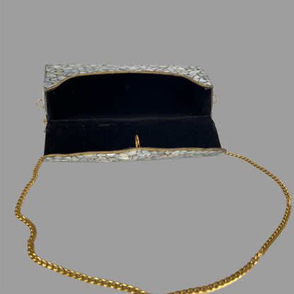 Marble finish metallic clutch