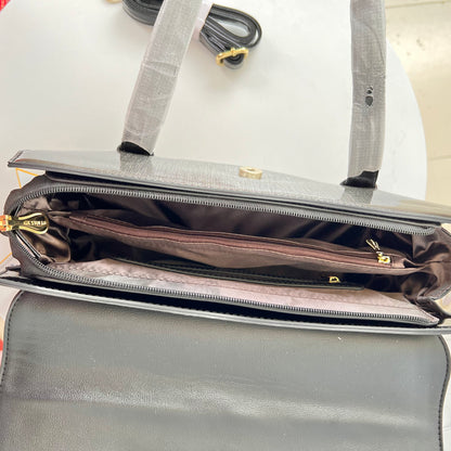 Designer shining leather handbag with stonework