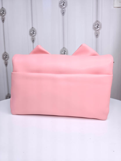 Soft leather peach bow bag with detachable sling