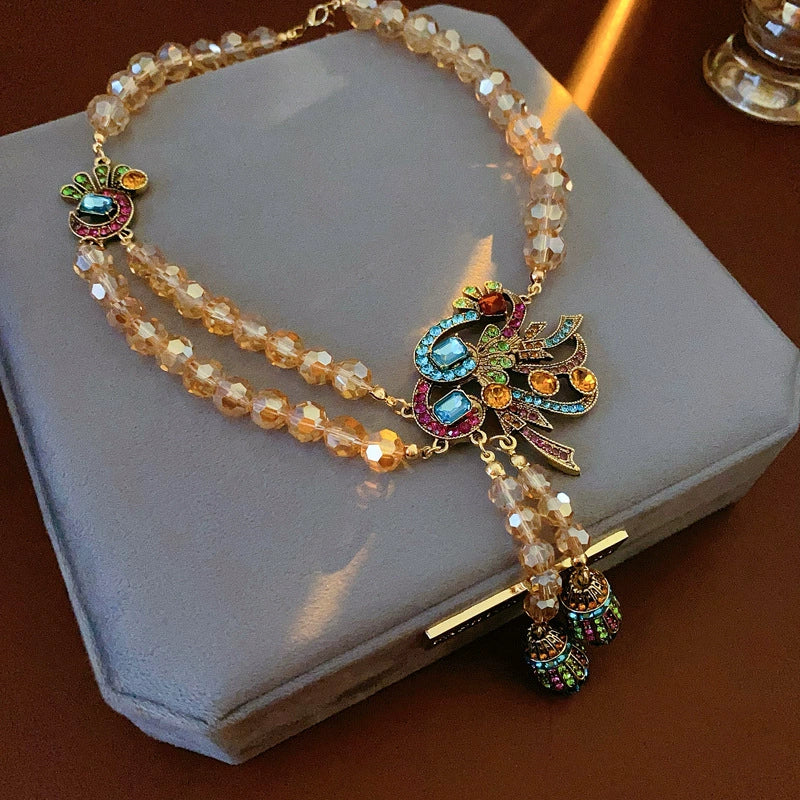 Opulent Amber Beaded Peacock Charm Tassel Necklace