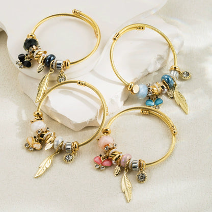 Whimsical Gold & Blue Charm Bracelet Butterfly Feather