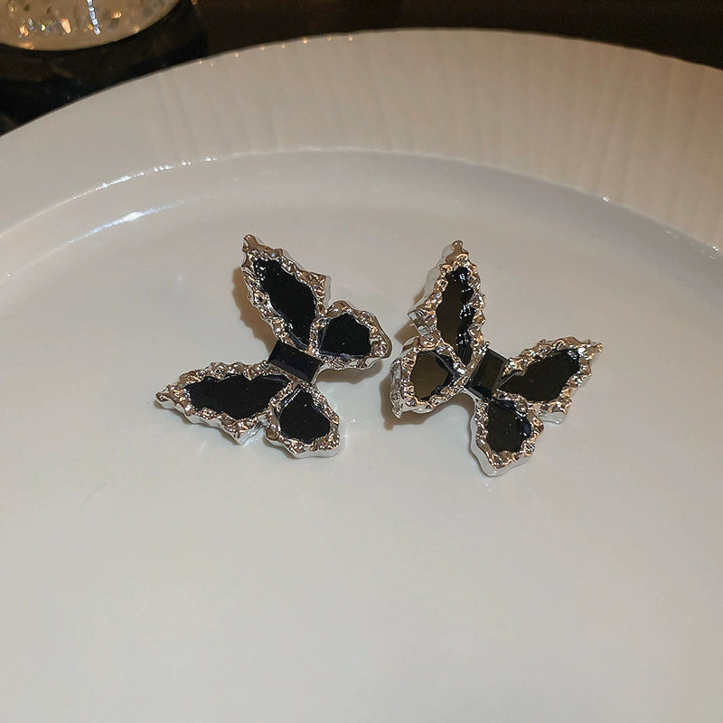 Edgy Black Butterfly Stud Earrings with Textured Silver