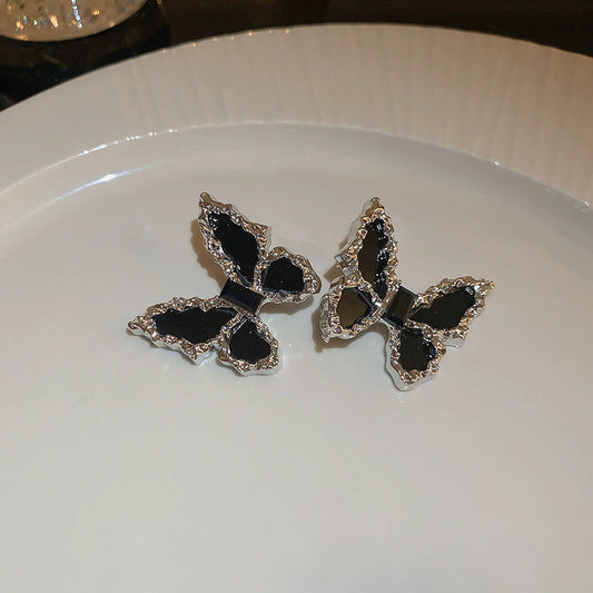 Edgy Black Butterfly Stud Earrings with Textured Silver