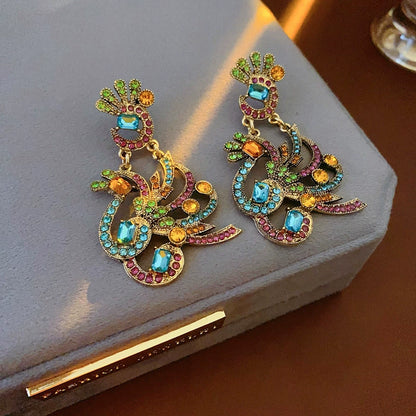 Opulent Amber Beaded Peacock Charm Tassel Necklace